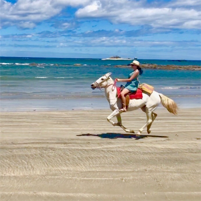 Horseback riding on the beach in Playa Tamarindo